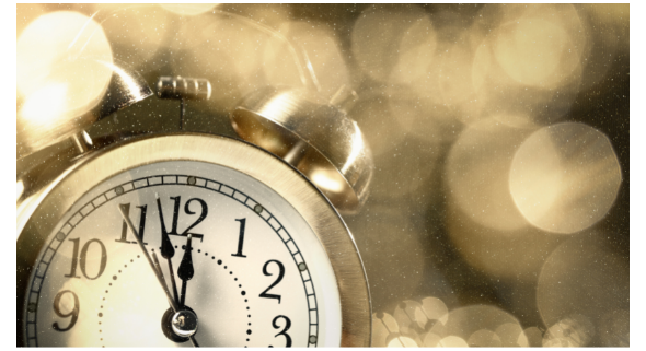 Clock close-up minute 2 midnight w/gold background