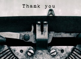 Closeup photo of typewriter w 'Thank you' typed out