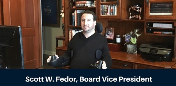 Photo of Scott Fedor, Vice President of LEAP's board, sitting behind his desk at his office.