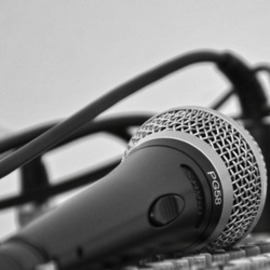 Close-up photo of a microphone in black & white
