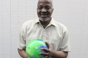 Reggie enjoys knocking those pins down!